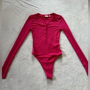 Aritzia Sunday Best Pink bodysuit. Size 2XS.